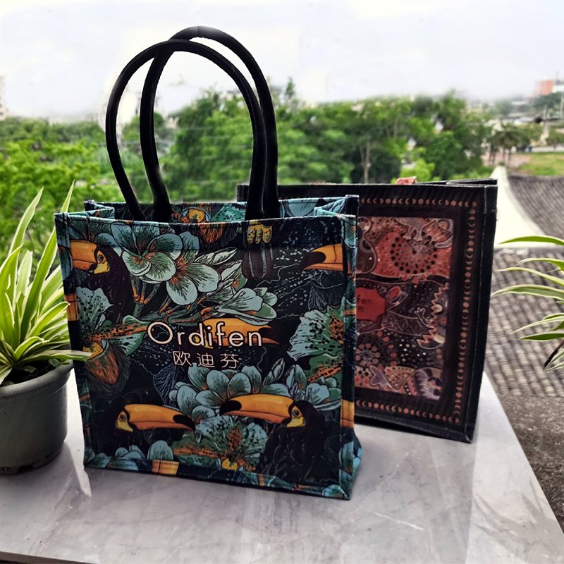 Canvas tote with tropical toucan print for lifestyle brands