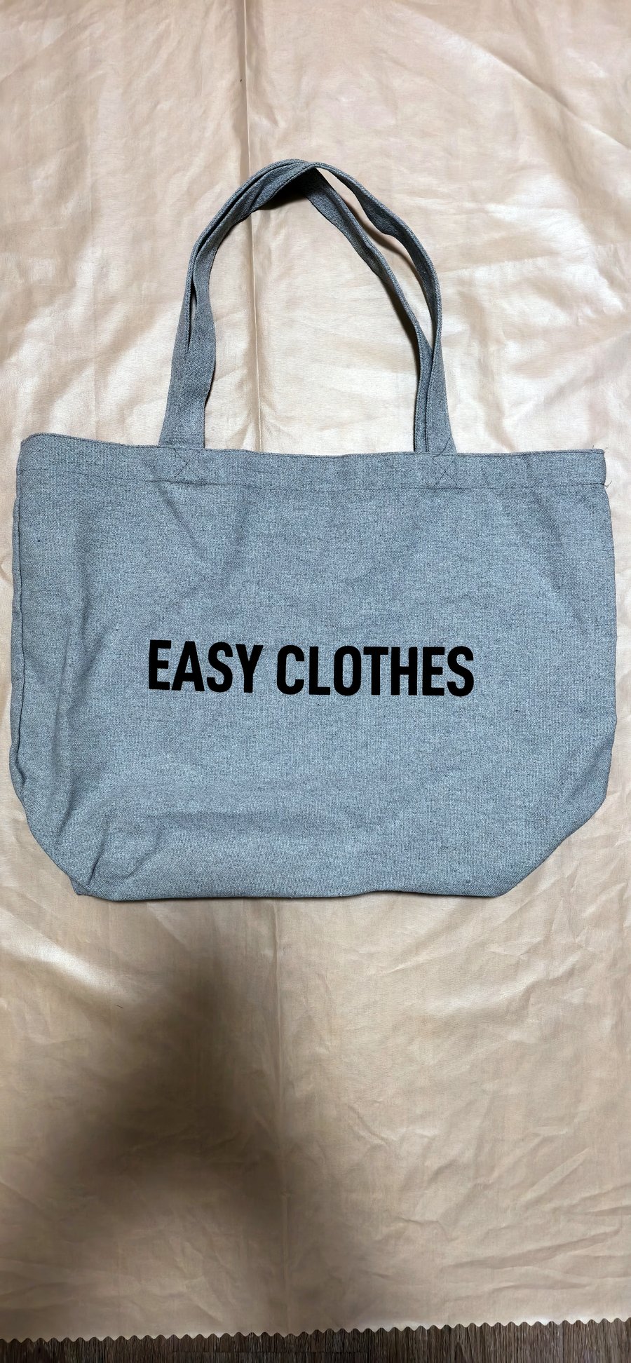 Cold Brew branded black cotton canvas tote bag — "Art in every drop" white script print